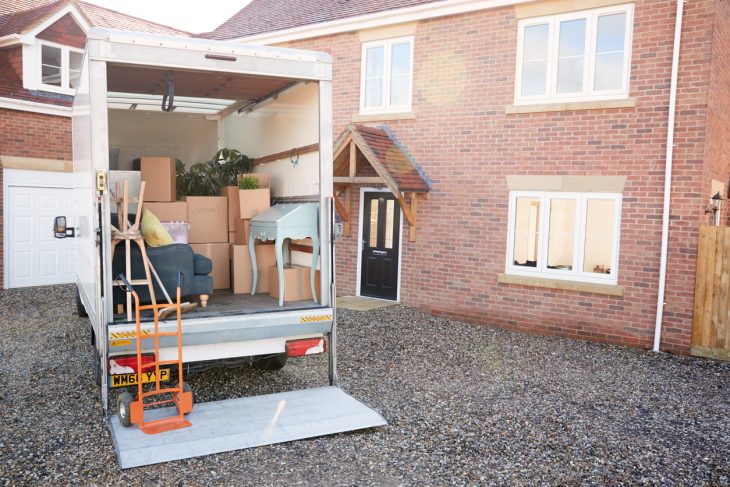 Removal truck outside a house