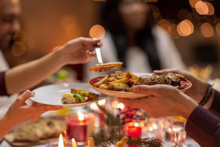 People handing out Christmas dinner